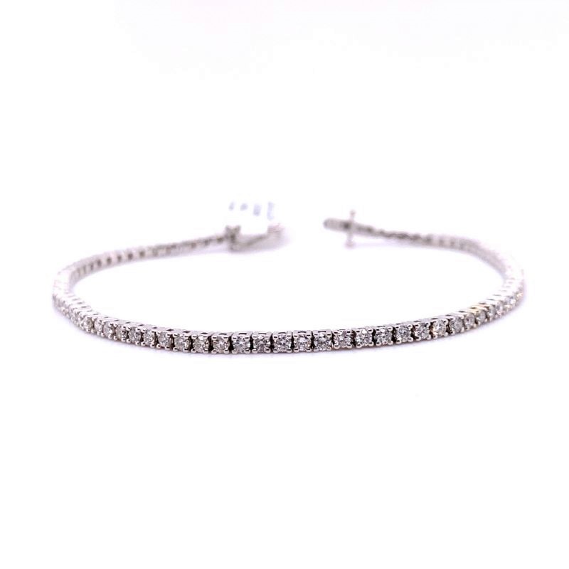 a diamond tennis bracelet on a white background