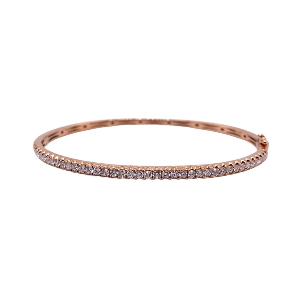 a rose gold bang bracelet with white diamonds