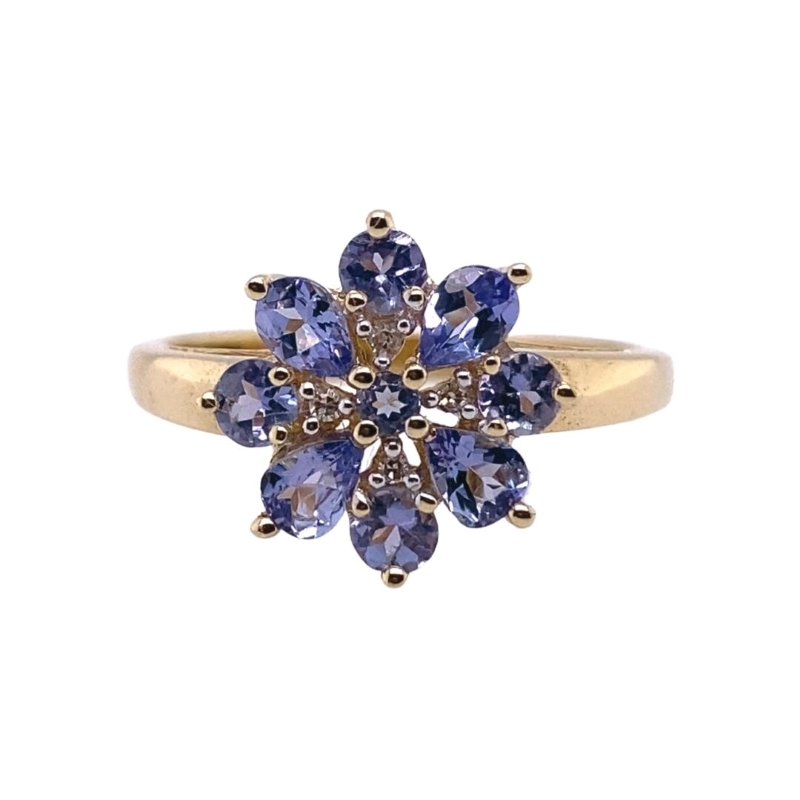 a gold ring with tan and blue stones