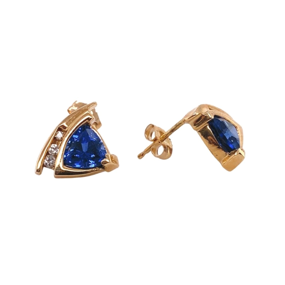 a pair of earrings with blue stones