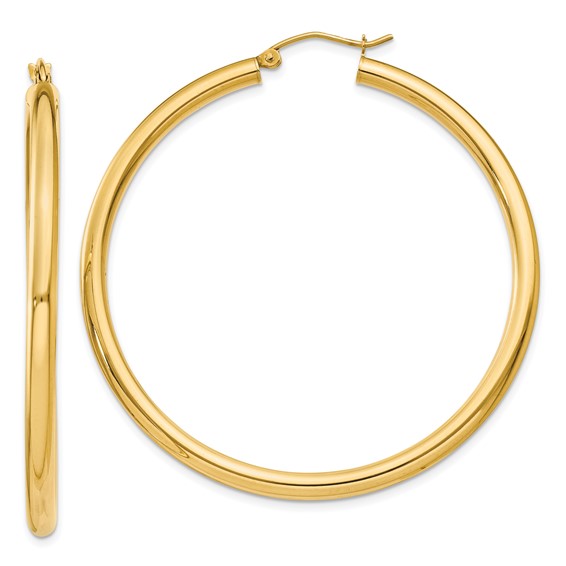 a pair of gold hoop earrings on a white background
