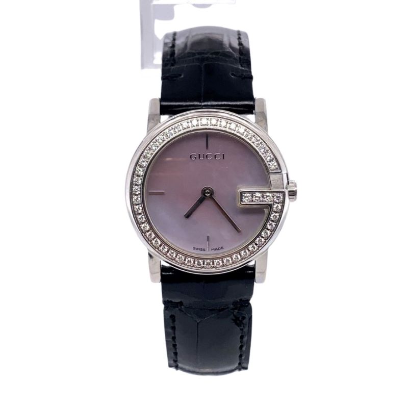 a women's watch with black leather strap