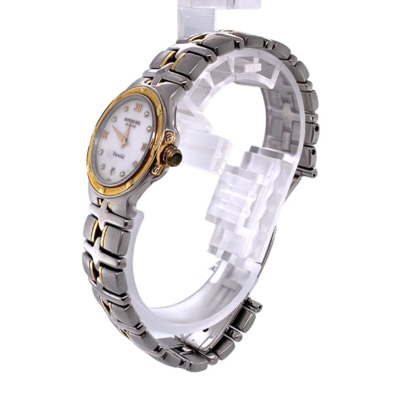 a women's watch with two tone gold and white dials