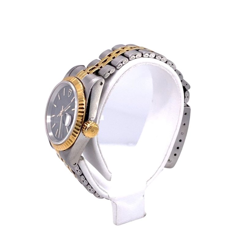 a watch with two tone gold and silver dials