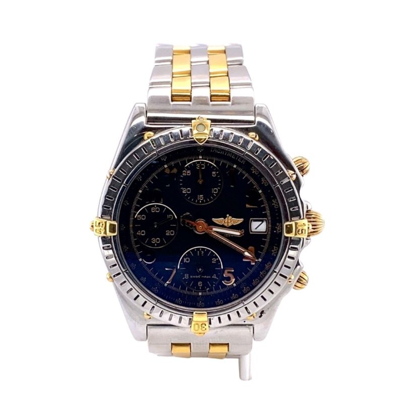 a watch with two tone gold and blue dials