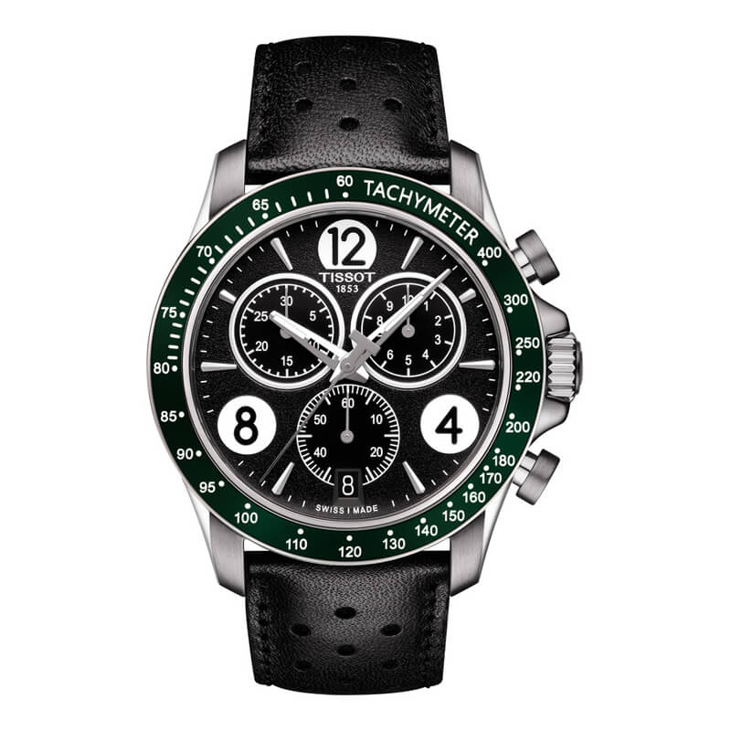 a black and green watch on a white background