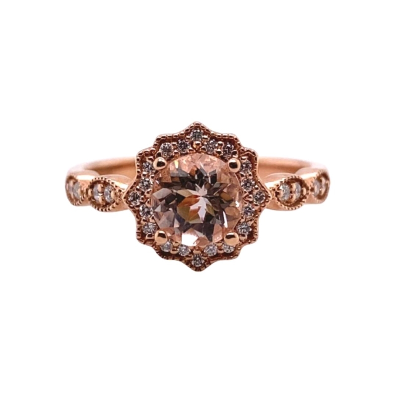 a ring with an oval shaped morganite surrounded by smaller diamonds