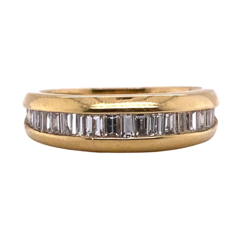 an 18 carat yellow gold band with baguets
