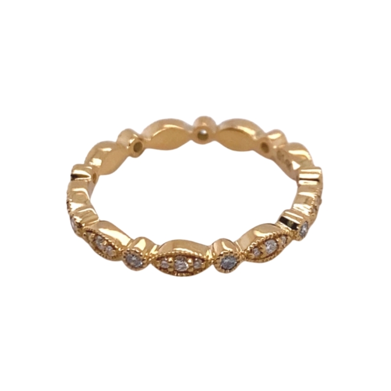 a gold ring with small diamonds on it