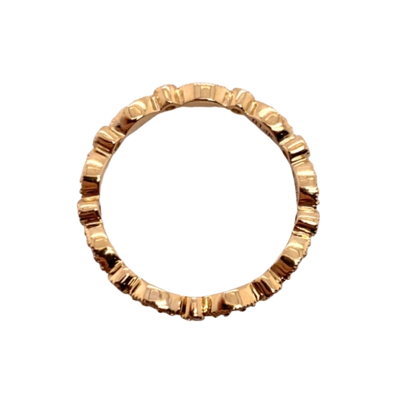 a gold ring with small beads on it