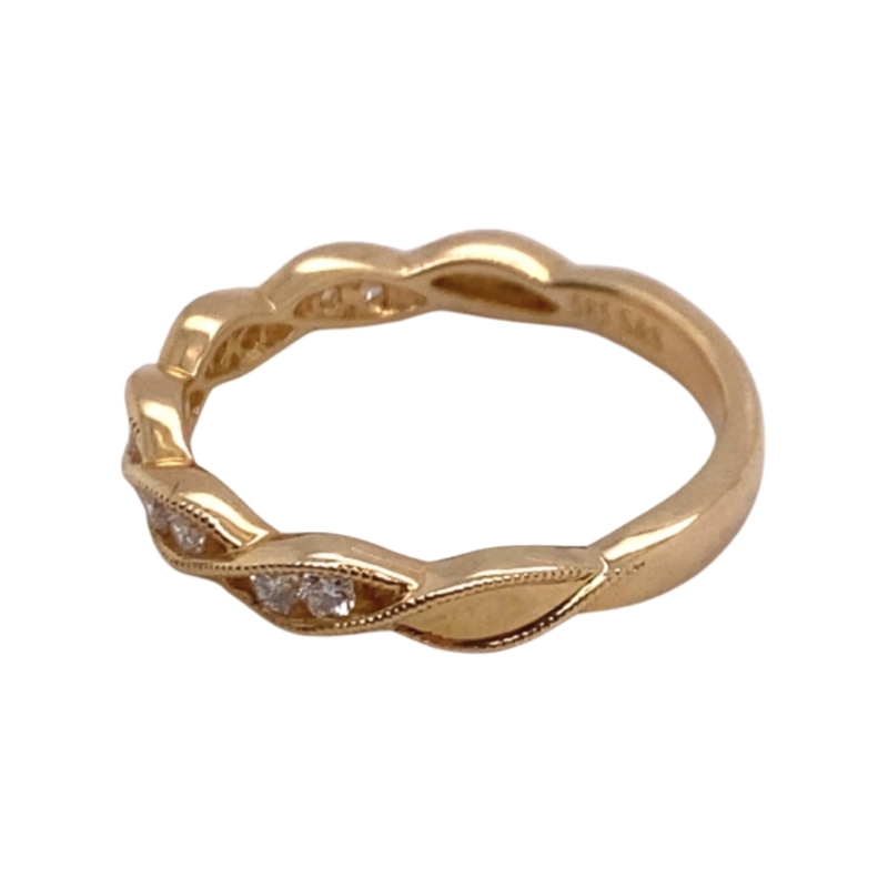 a gold ring with diamonds on it