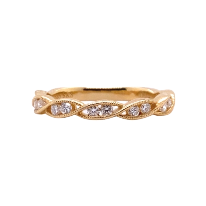 a gold ring with three diamonds on it