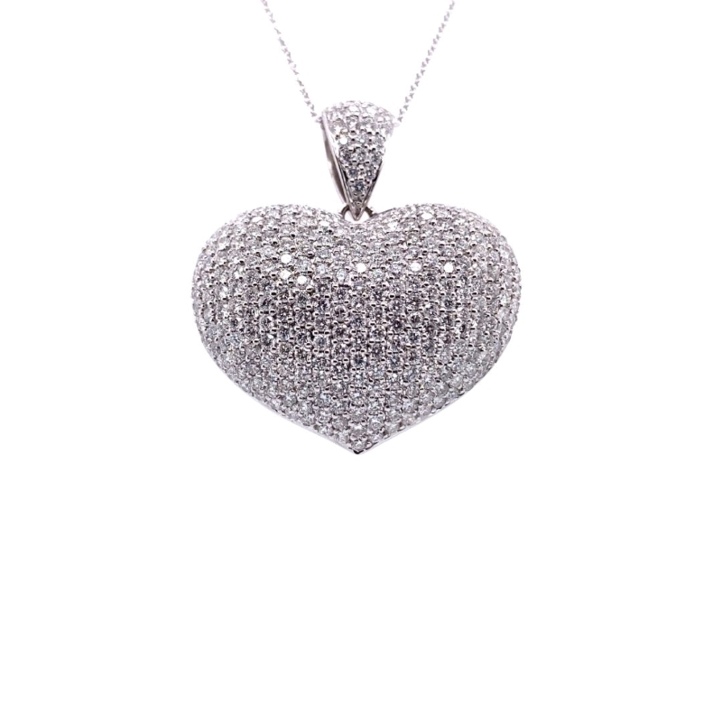 a heart shaped pendant with diamonds on it