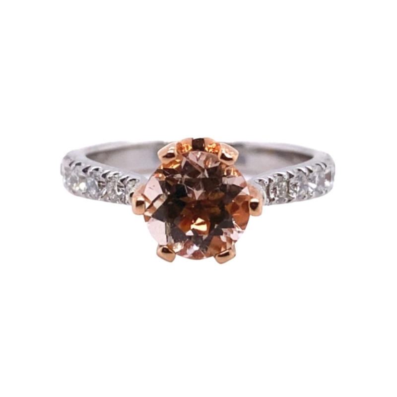 a ring with an orange and white diamond