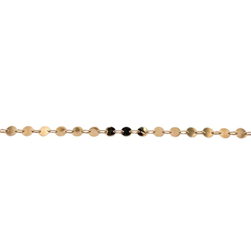 a gold chain with black beads on it