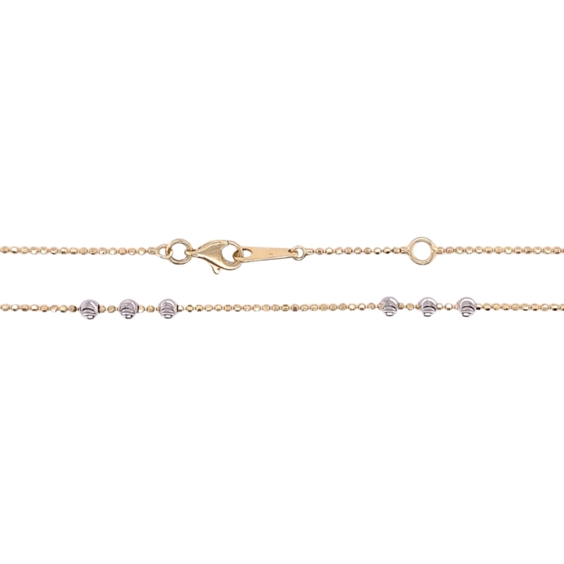 a yellow gold chain with white diamonds on it