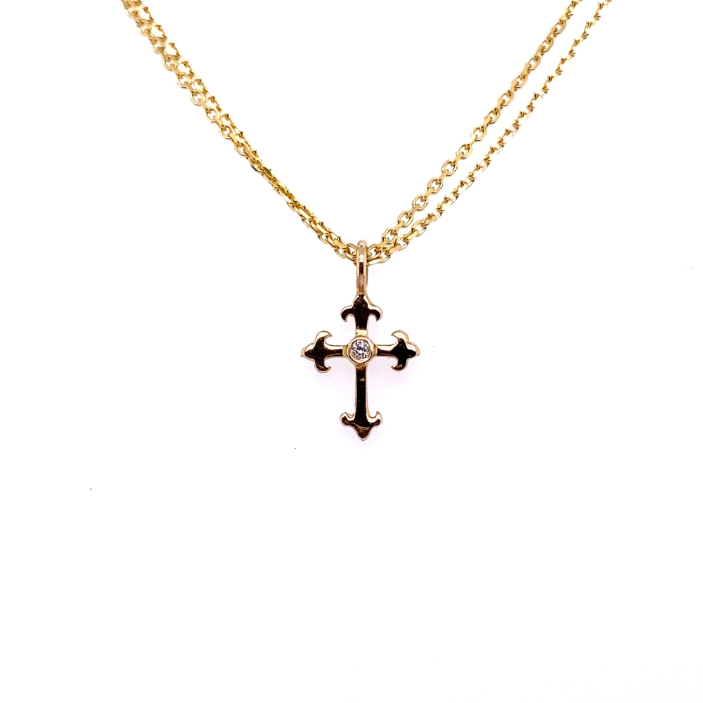 a cross necklace with a diamond on it