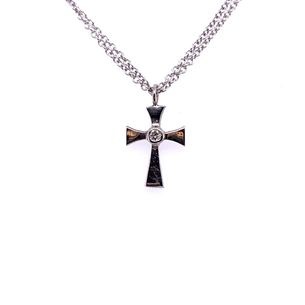 a cross necklace with a diamond on it