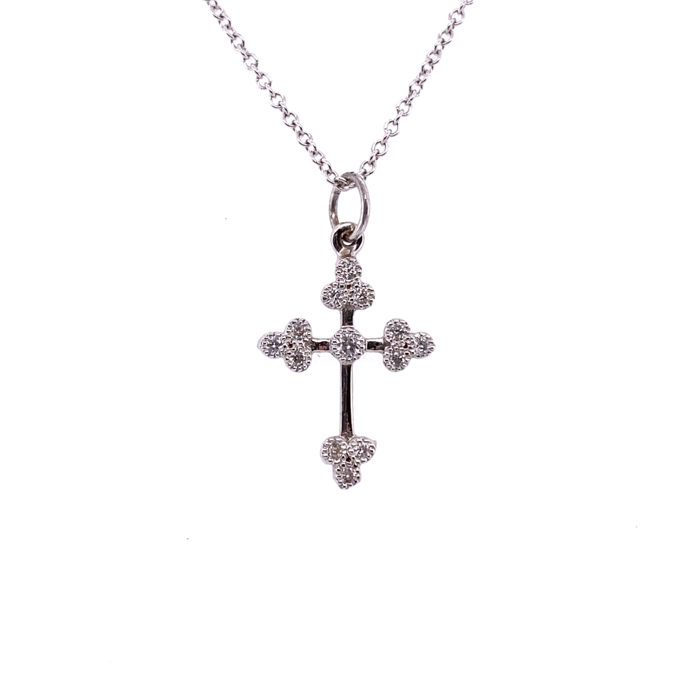 a silver cross necklace with four diamonds on it