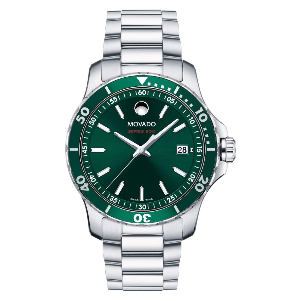 a green and silver watch on a white background