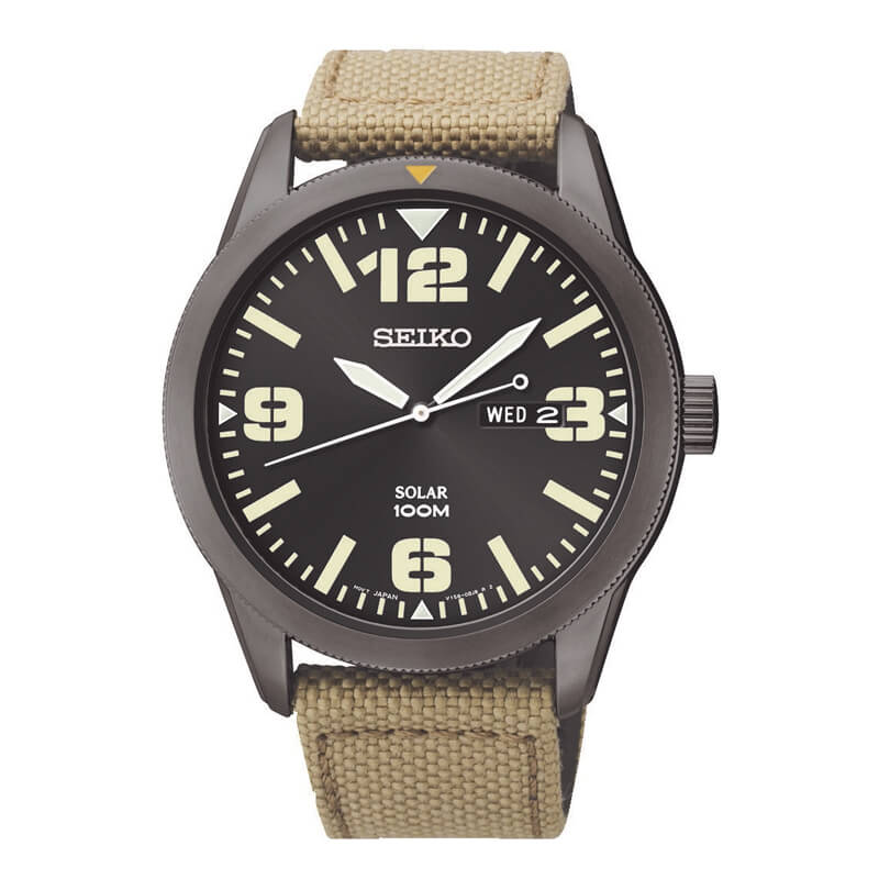 a watch with a black face and tan straps