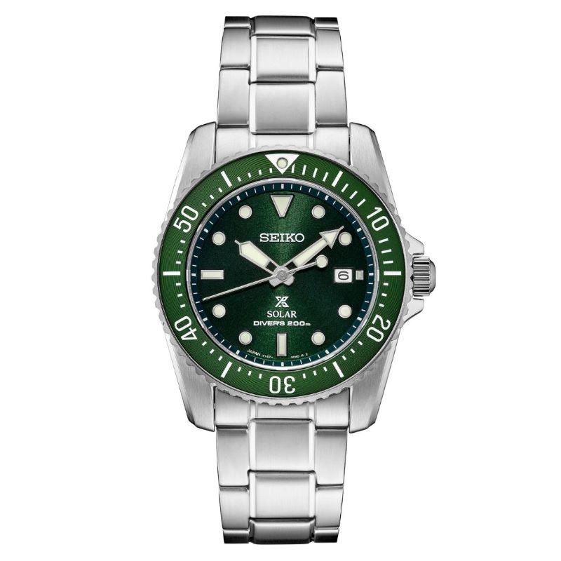 a watch with green dials on a bracelet