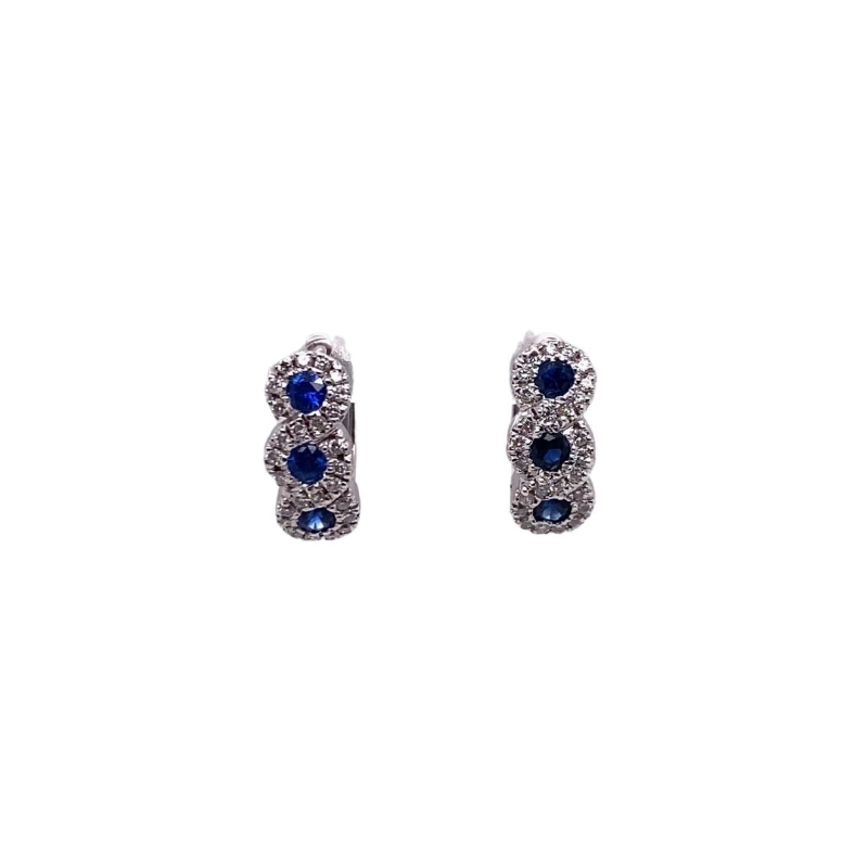 a pair of earrings with blue stones
