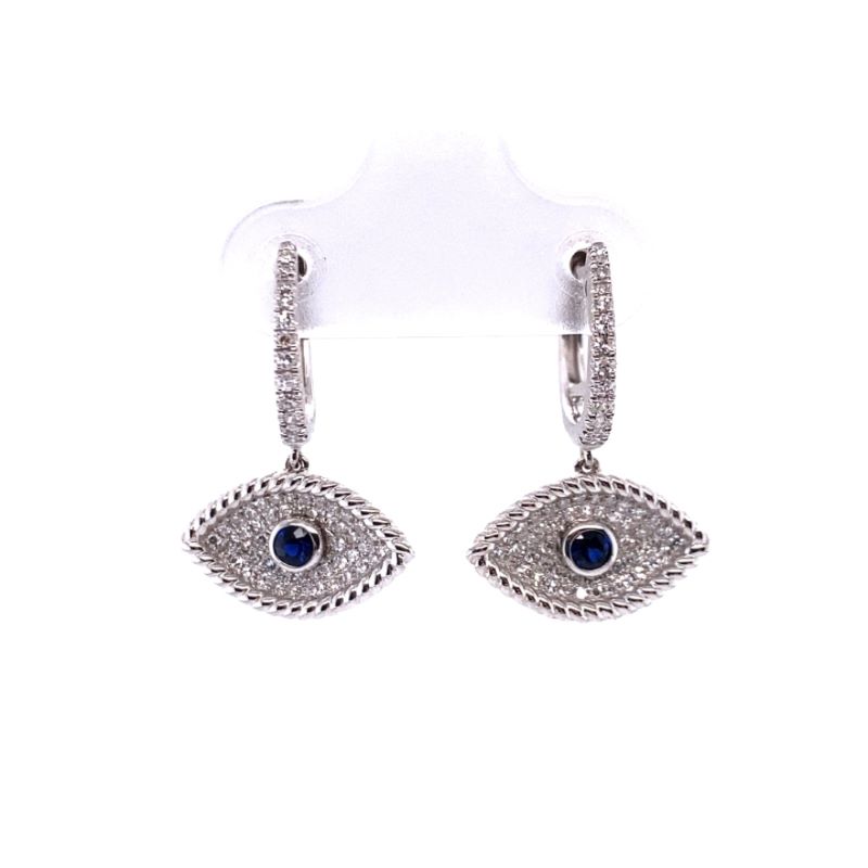 a pair of earrings with an evil eye