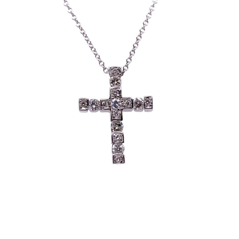 a silver cross necklace with diamonds on it