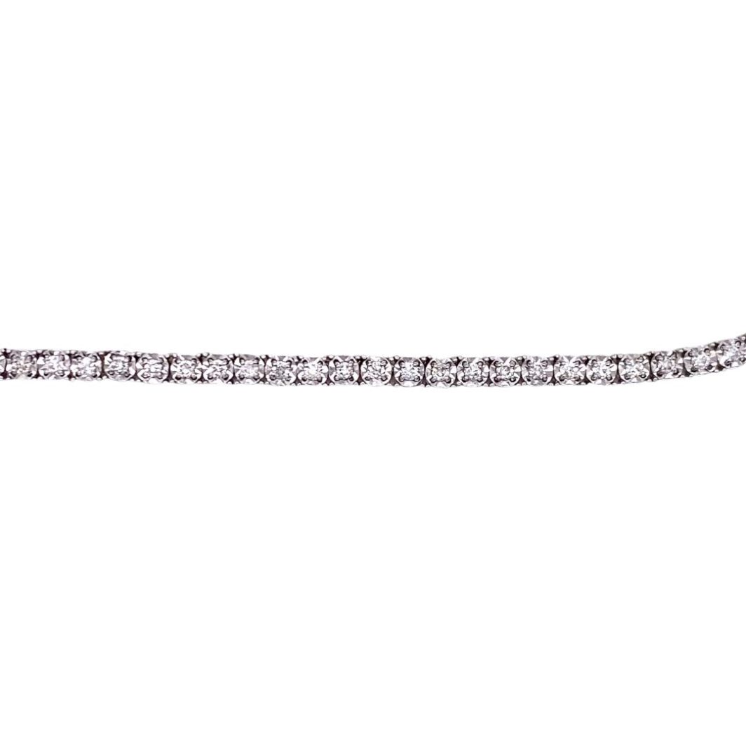 a diamond tennis bracelet on a white background