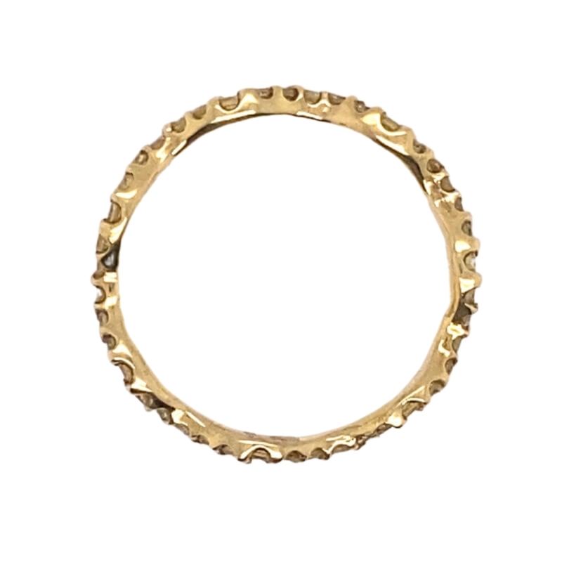 a gold ring with small dots on it