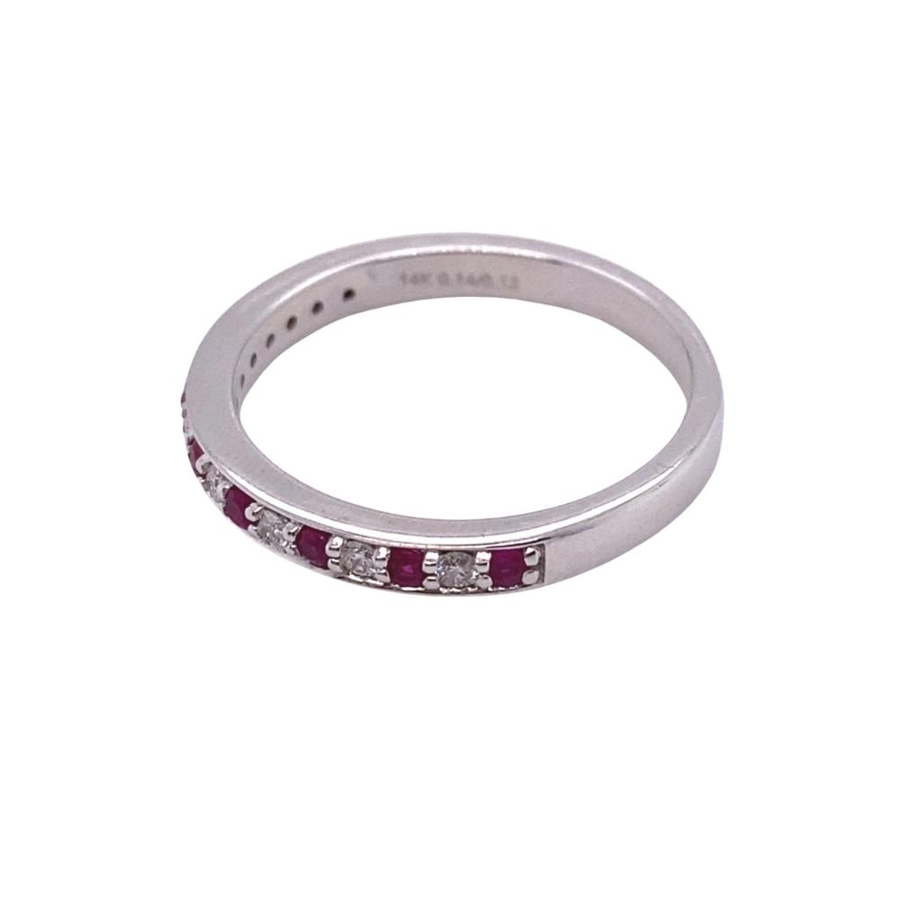 a white gold ring with red and white diamonds