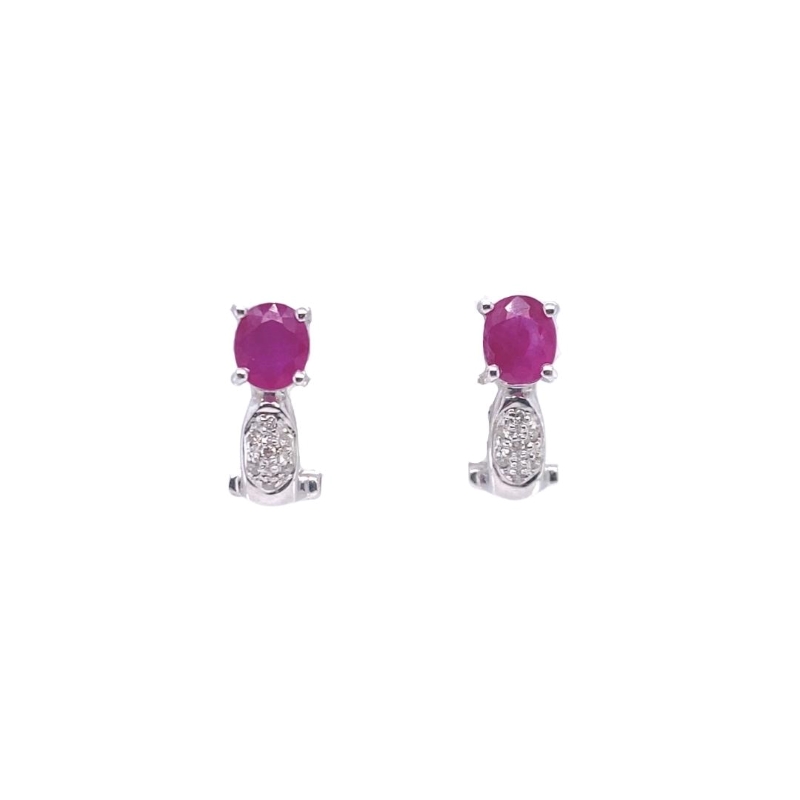 a pair of earrings with pink stones and diamonds