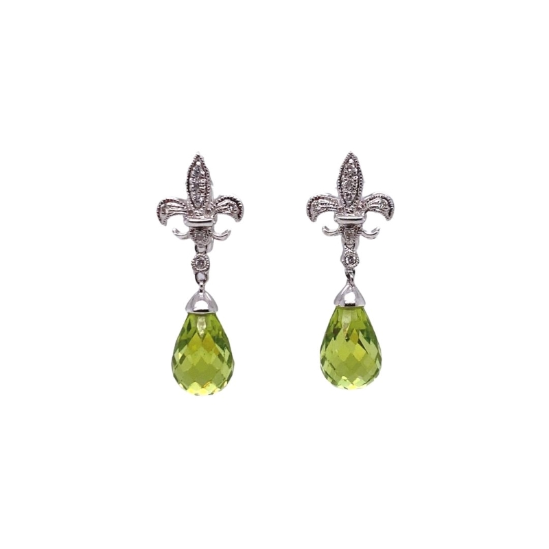 a pair of earrings with a cross and green stone