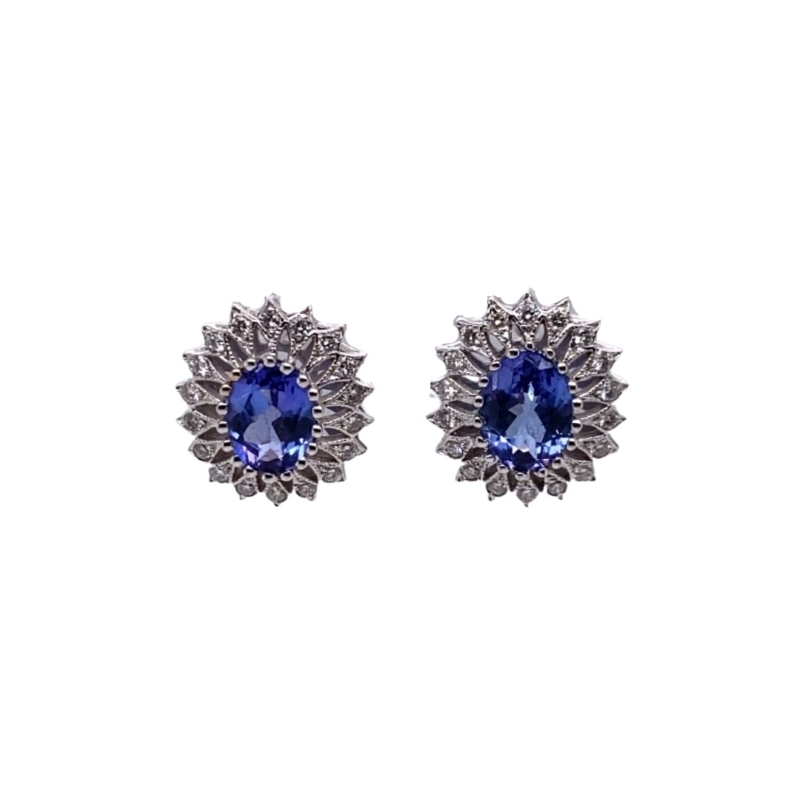 a pair of blue and white earrings