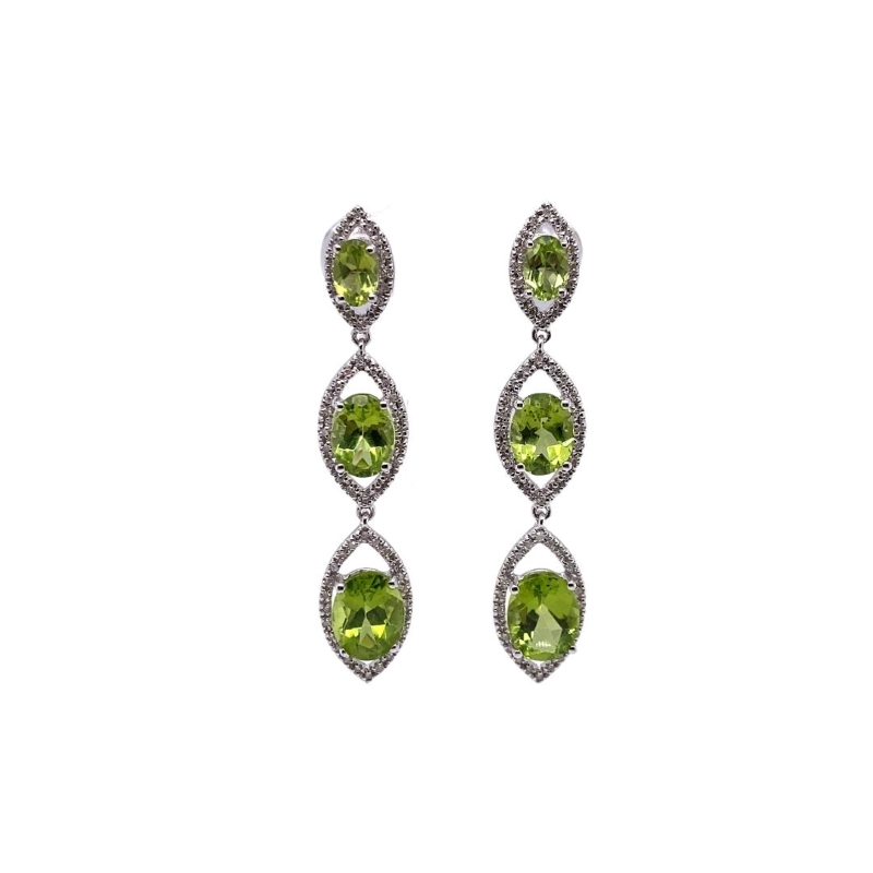 a pair of earrings with green stones and diamonds