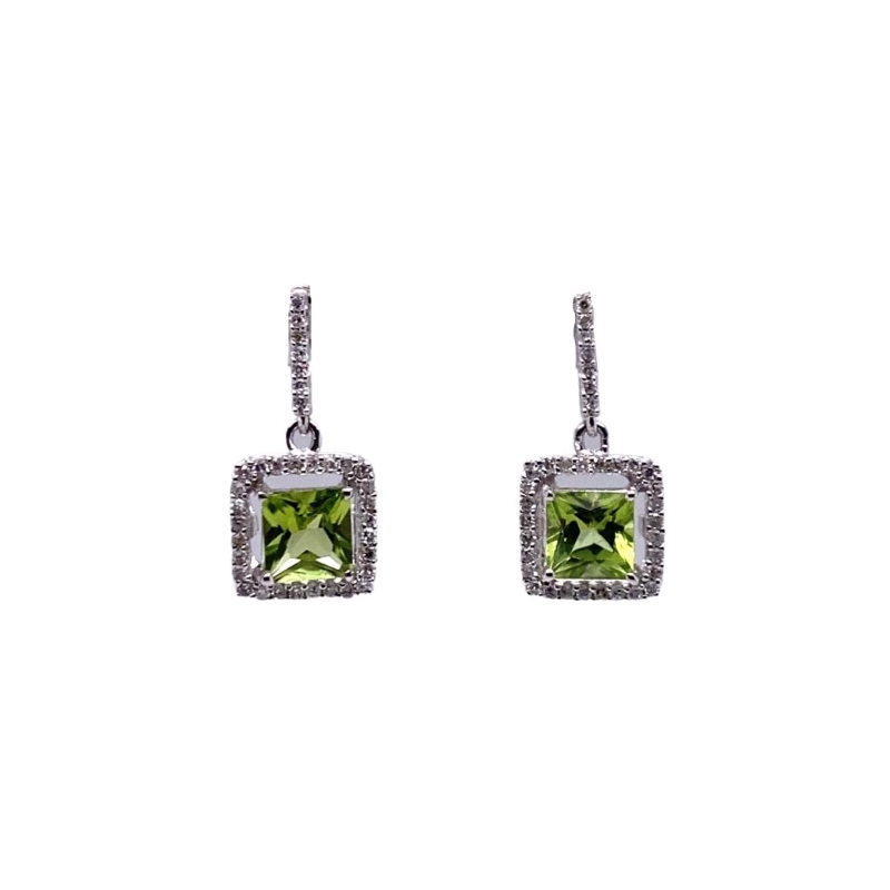 a pair of earrings with a square shaped green stone