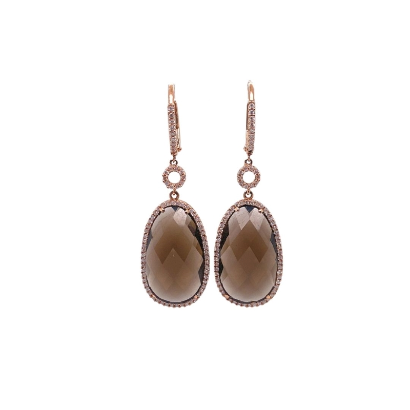 a pair of earrings with brown stones