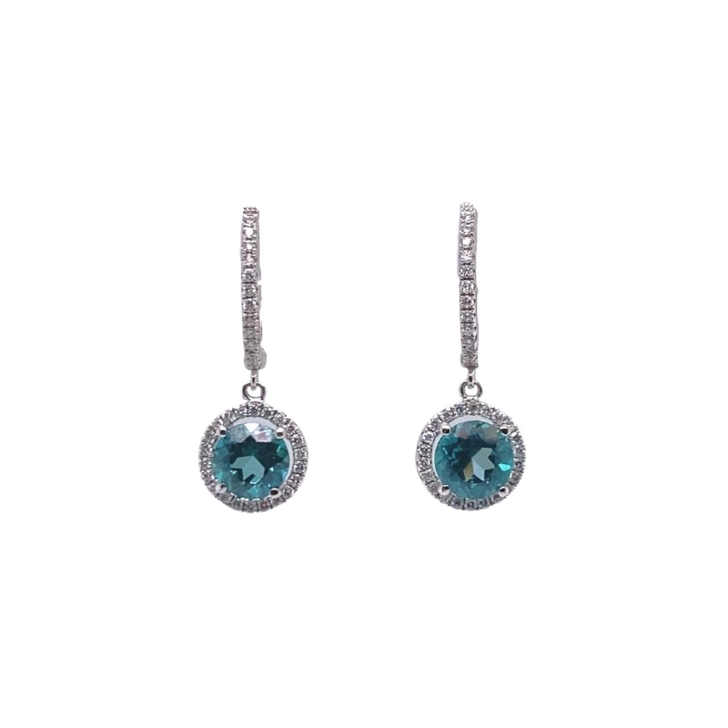 a pair of earrings with blue and white stones