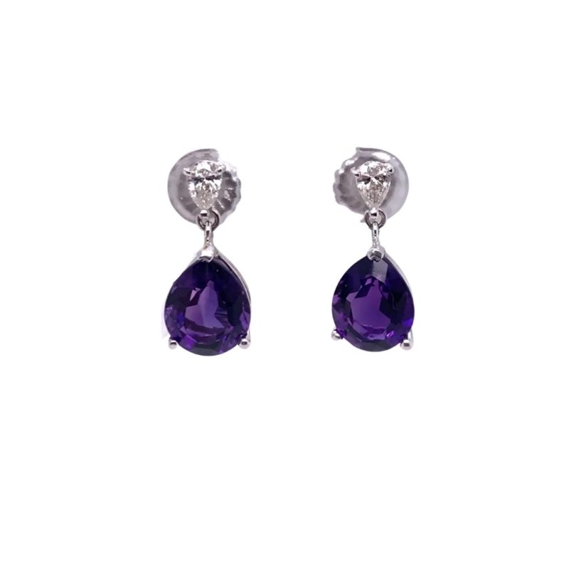 a pair of earrings with purple stones