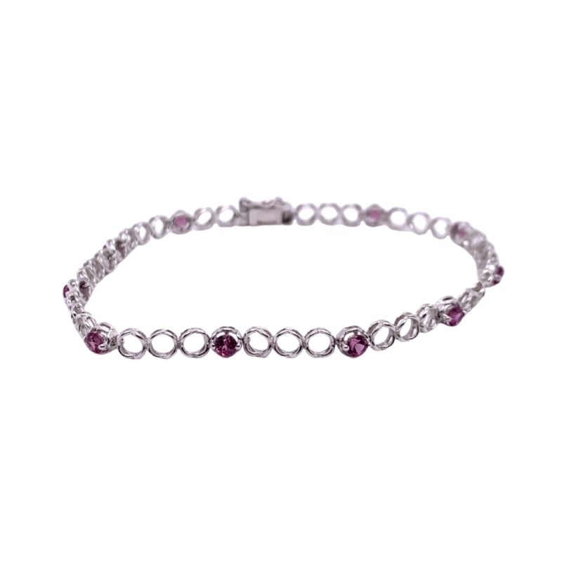 a silver bracelet with pink stones