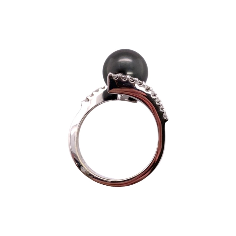 a black pearl and diamond ring on a white background