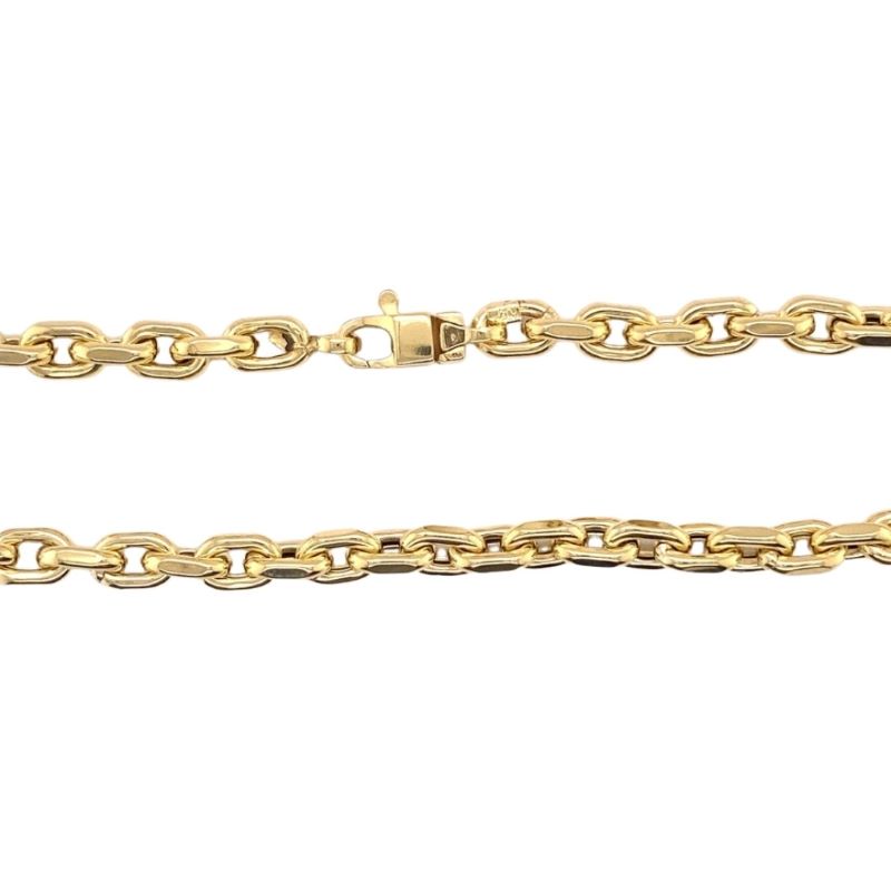 a yellow gold chain on a white background