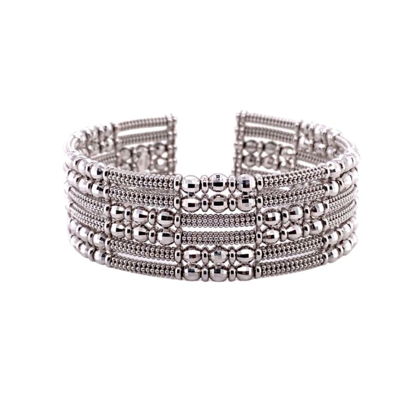 a stack of silver beaded bracelets