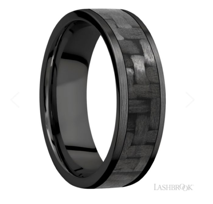 a black ceramic ring with an intricate design