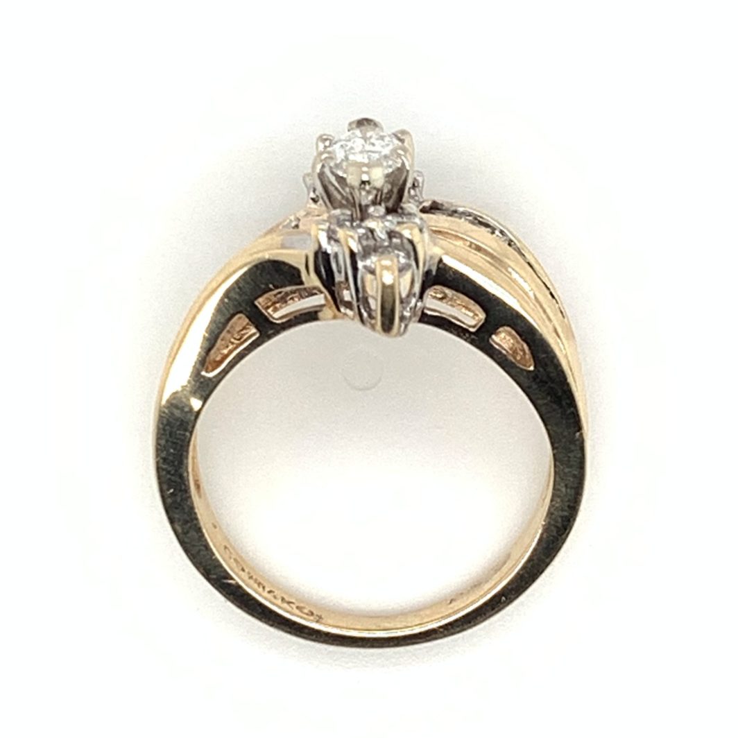 an engagement ring with a diamond on top