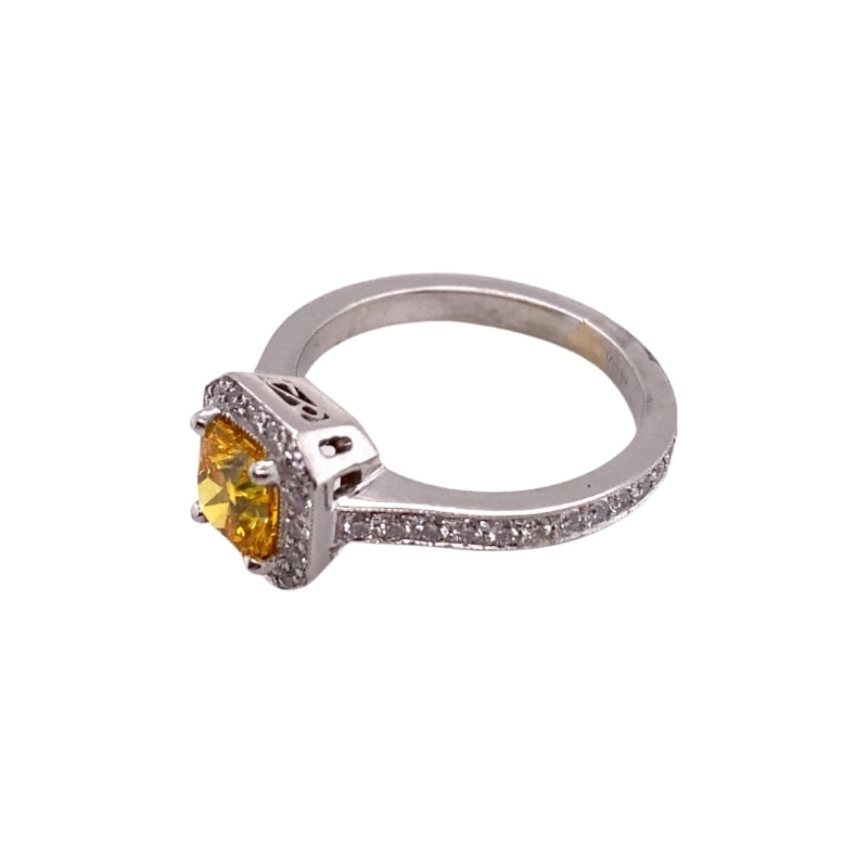 a ring with a yellow diamond in the center