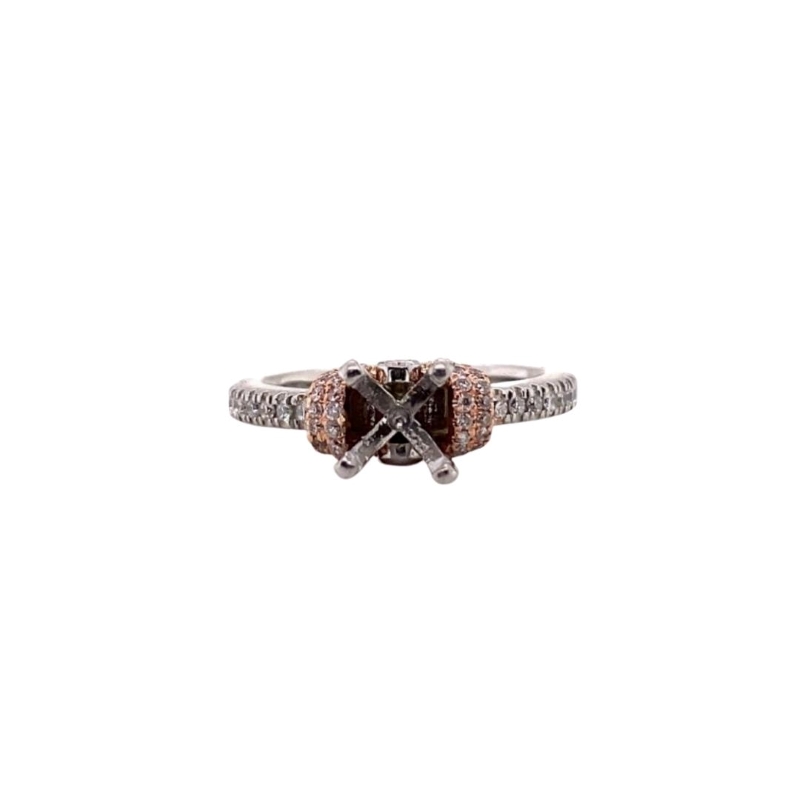 a white gold ring with two brown diamonds