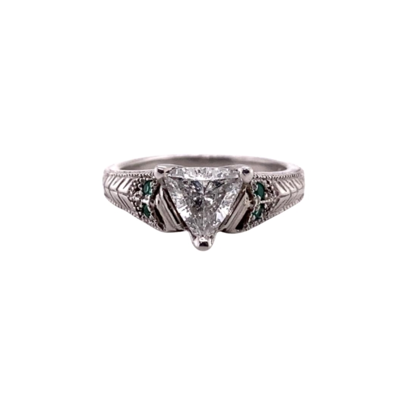 a white gold ring with green and white diamonds