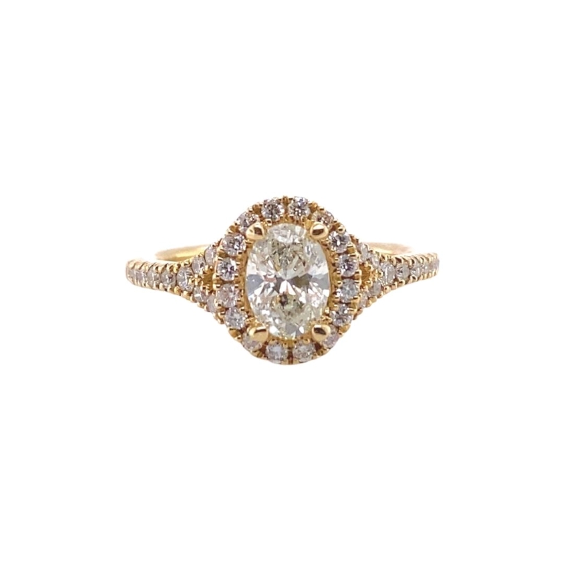 a yellow gold ring with a diamond center
